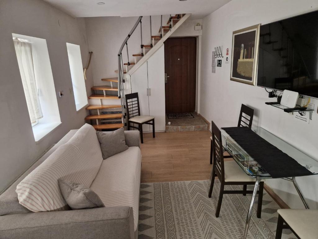 Televízia a/alebo spoločenská miestnosť v ubytovaní Studio Sweet Home