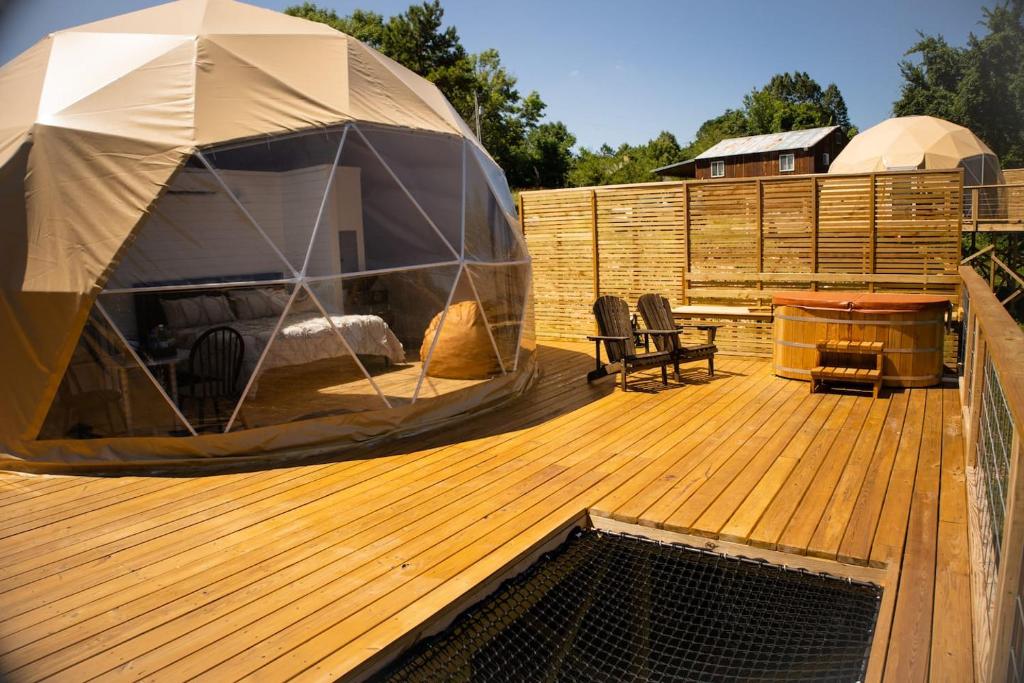 a gazebo on top of a wooden deck at Glamping Dome, Deck Cedar Hot Tub, Mountain View in Eureka Springs