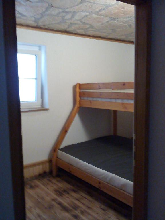 Poschodová posteľ alebo postele v izbe v ubytovaní Apartments Orlí Hnízdo