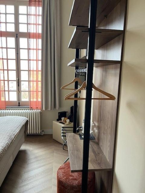 Postel nebo postele na pokoji v ubytování Amaryllis Hotel Veurne