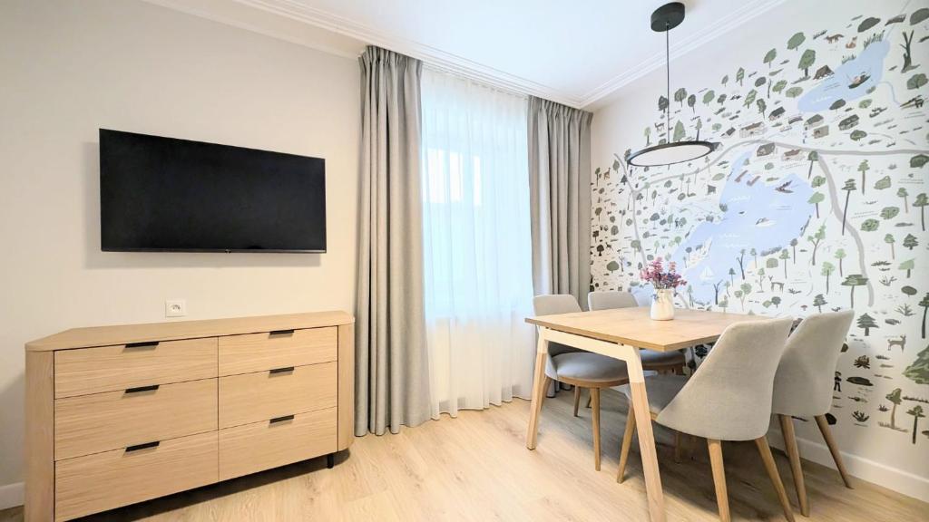 TV a/nebo společenská místnost v ubytování Modrak Apartamenty