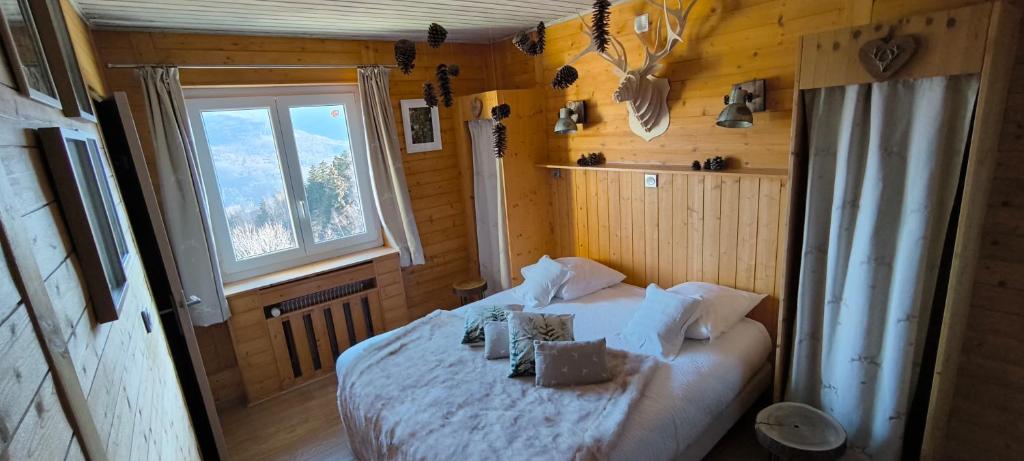 Postel nebo postele na pokoji v ubytování Les 4 Saisons