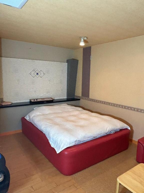 Postel nebo postele na pokoji v ubytování ホテル かくれんぼ Hotel kakurenbo