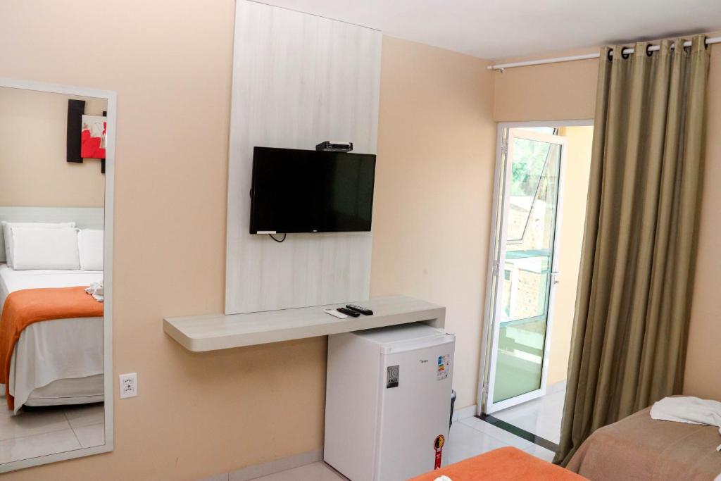 Uma cama ou camas num quarto em Pousada Badejo