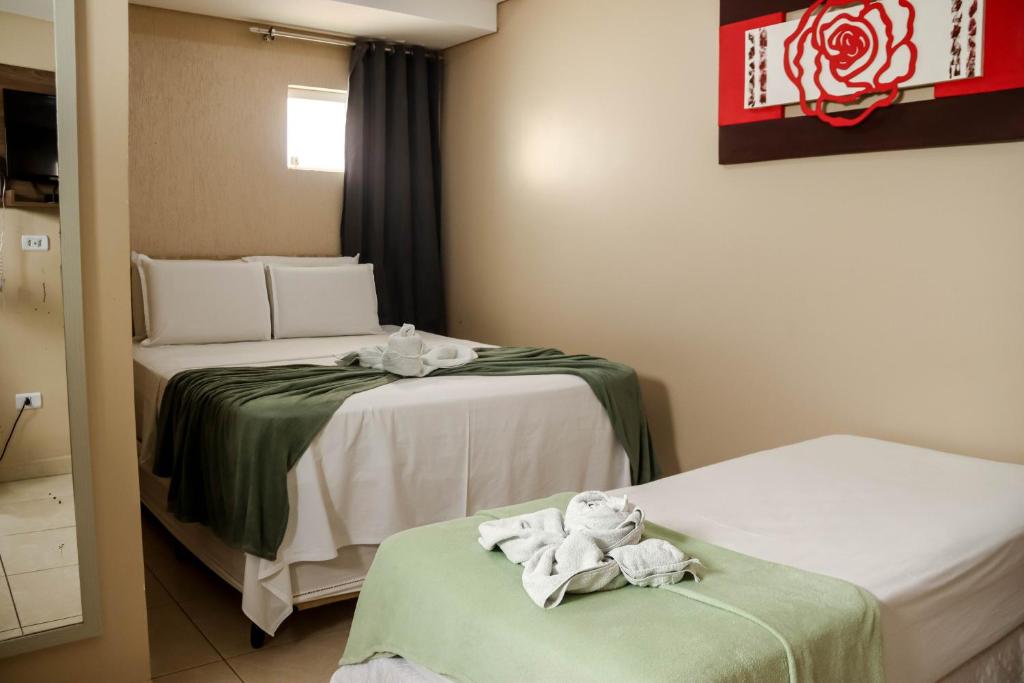 Uma cama ou camas num quarto em Pousada Badejo