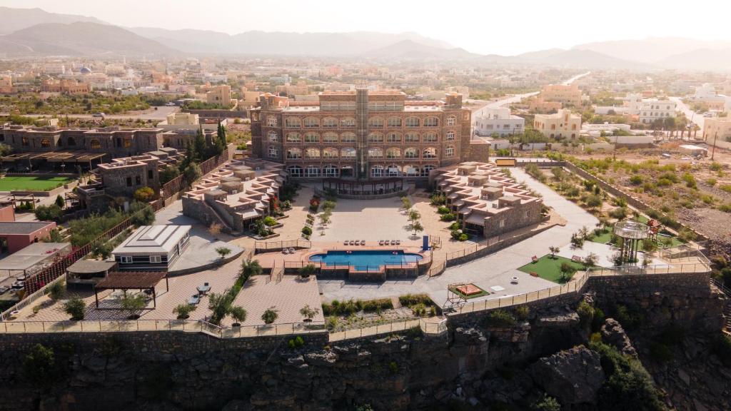 an aerial view of a building with a pool at Sama Hotel Jabal Al Akhdar in Al ‘Aqar