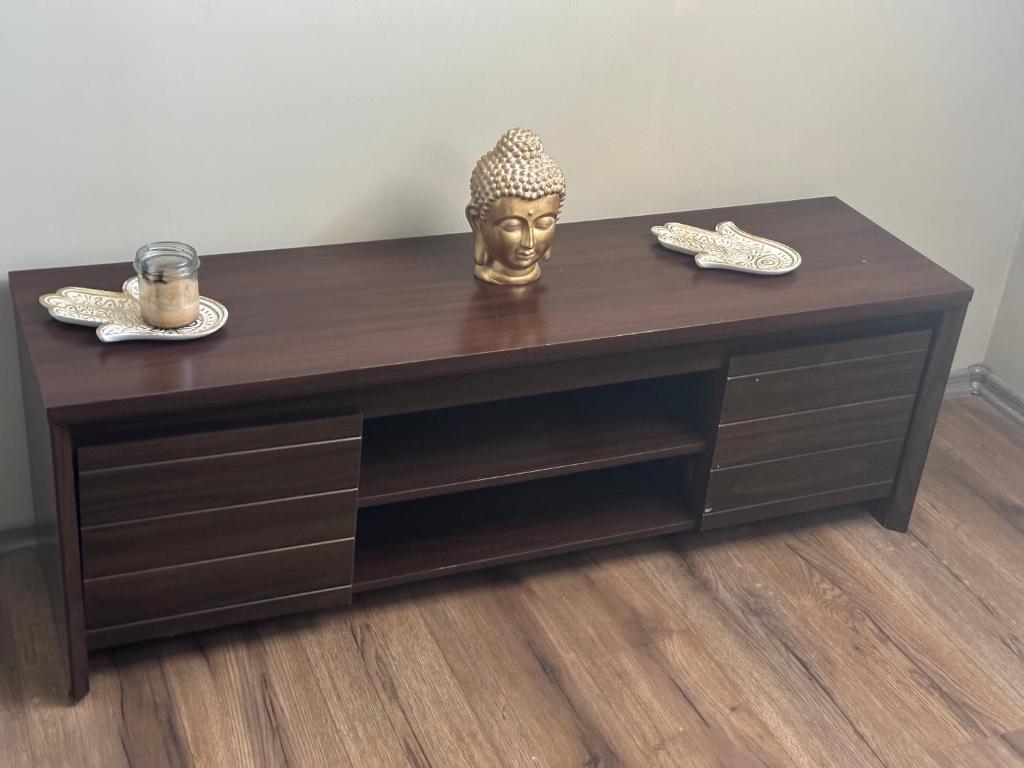 a table with a gold head on top of it at Loft&Cozy in Zgorzelec
