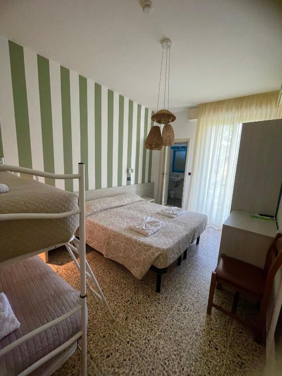 Postel nebo postele na pokoji v ubytování Hotel Reale