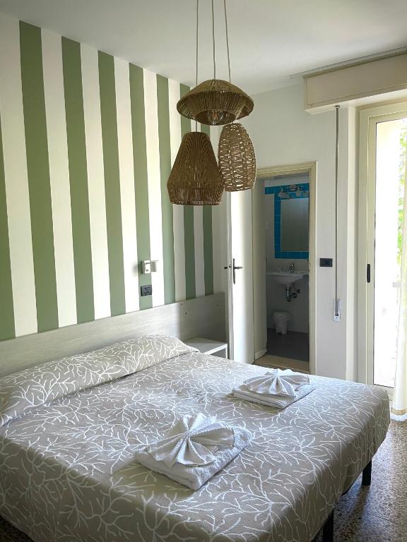Postel nebo postele na pokoji v ubytování Hotel Reale