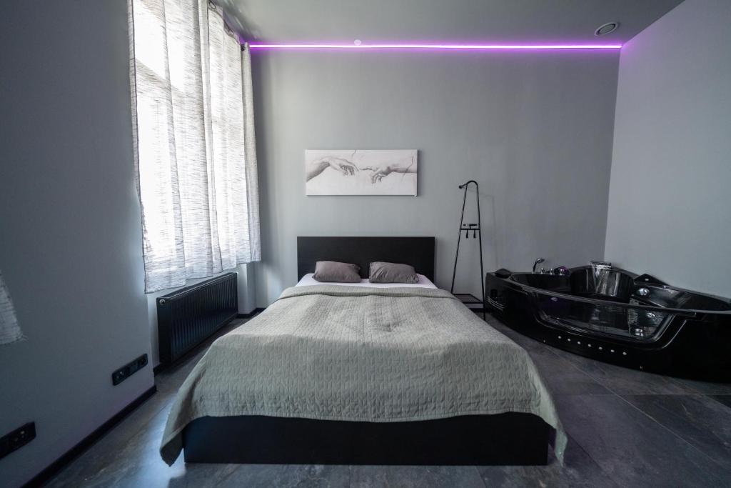 Postel nebo postele na pokoji v ubytování Wellness Rooms Central