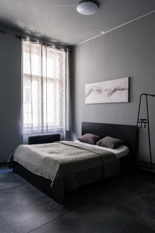 Postel nebo postele na pokoji v ubytování Wellness Rooms Central