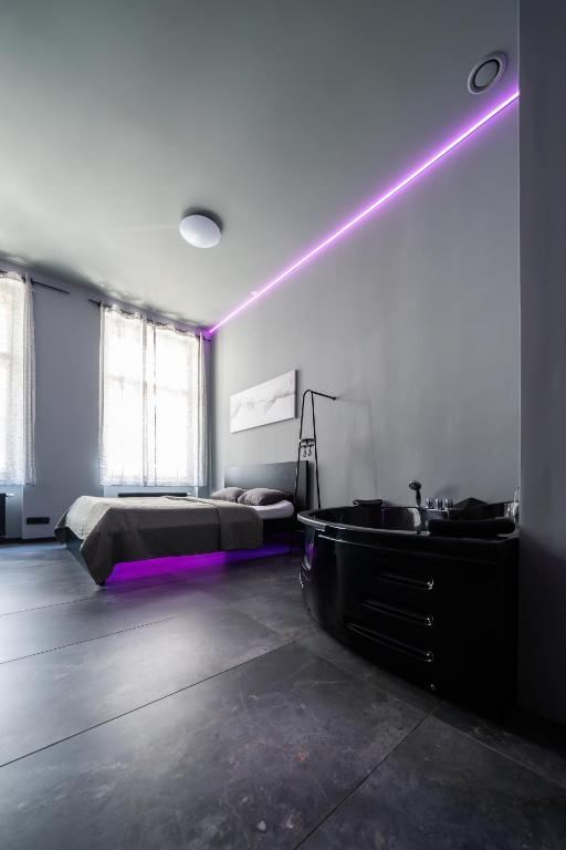 Postel nebo postele na pokoji v ubytování Wellness Rooms Central