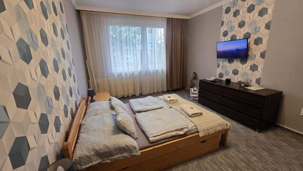 Postel nebo postele na pokoji v ubytování Dóra apartman best location