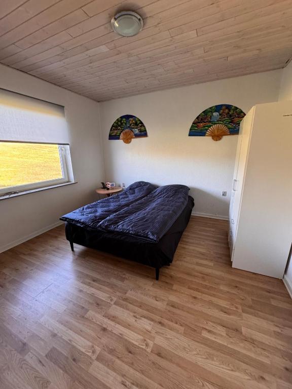 Postel nebo postele na pokoji v ubytování Hus tæt på Danfoss universe og strand