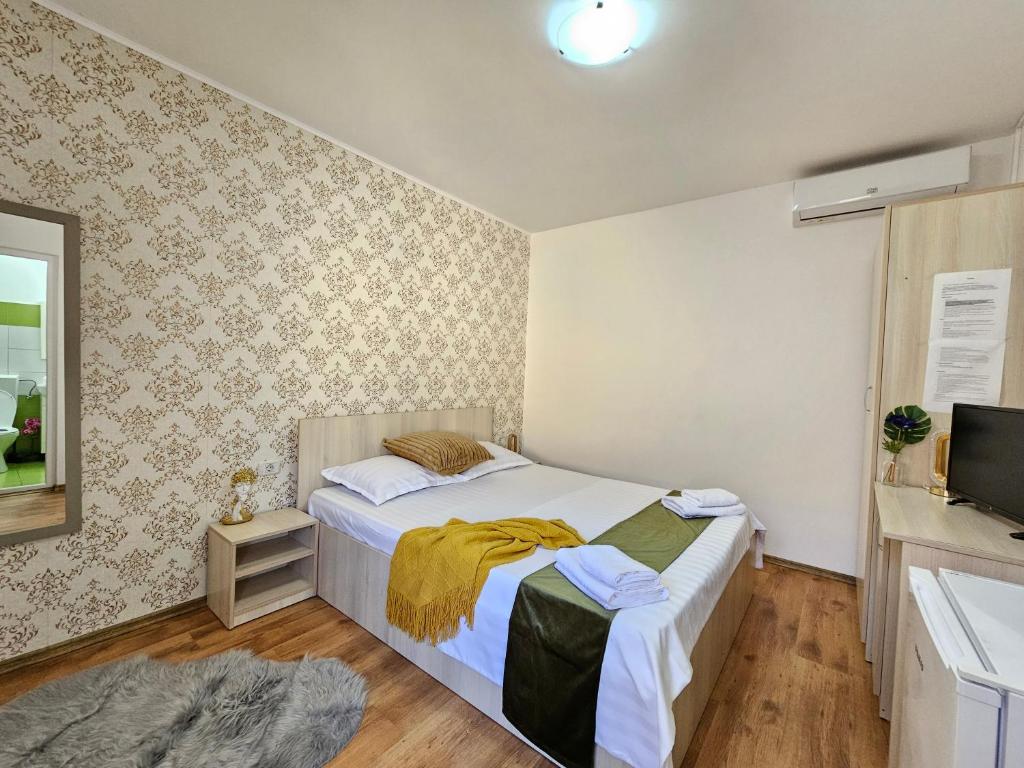 Postel nebo postele na pokoji v ubytování PENSIUNEA SCOICA