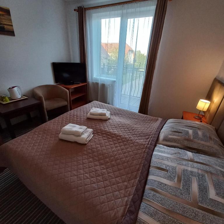 Postel nebo postele na pokoji v ubytování Akwen