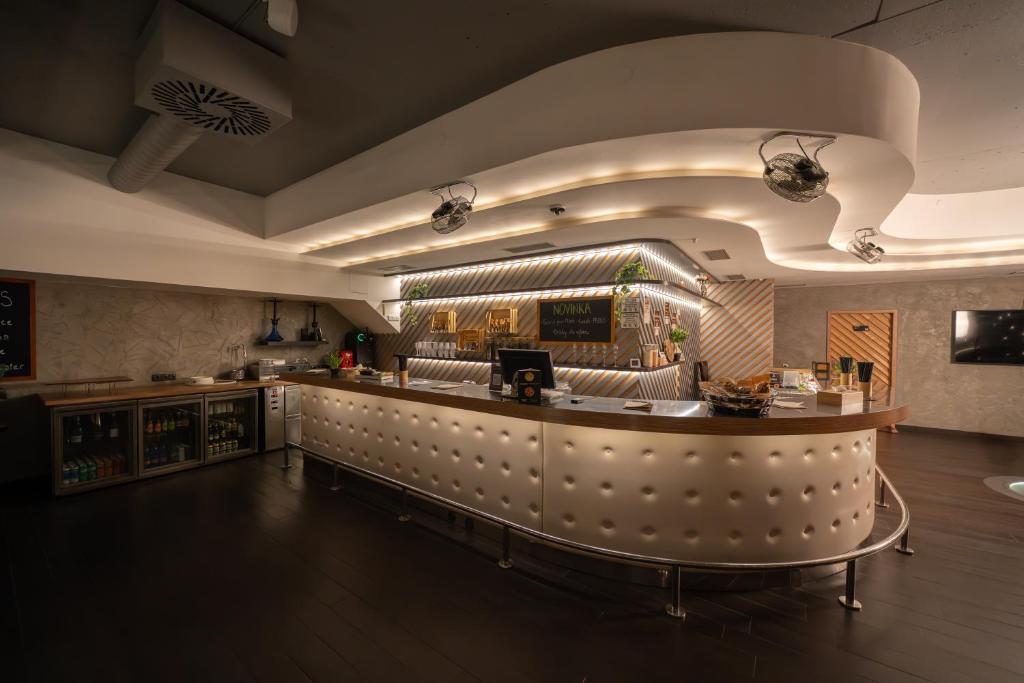 TV a/nebo společenská místnost v ubytování Wellness Rooms Central