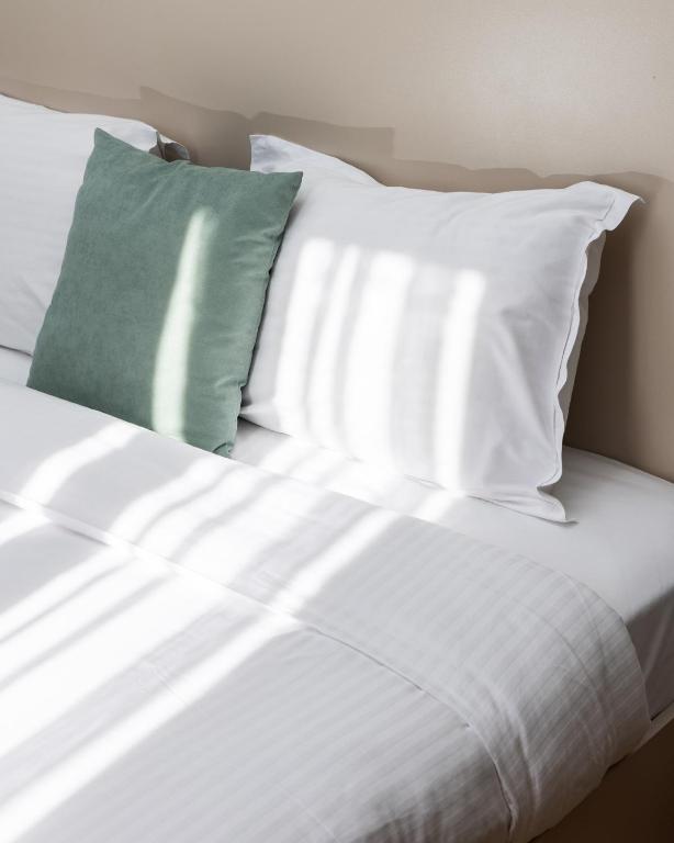 Postel nebo postele na pokoji v ubytování Hotel Ma Belle