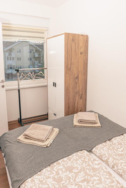Letto o letti in una camera di L & S Apartmani