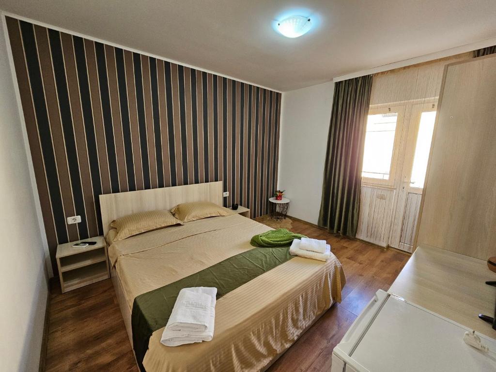 Postel nebo postele na pokoji v ubytování PENSIUNEA SCOICA
