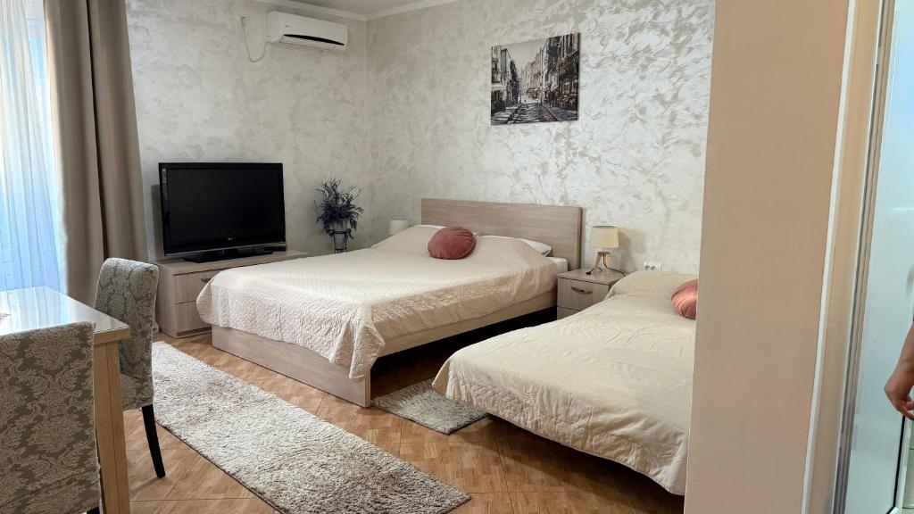 Postel nebo postele na pokoji v ubytování Oassis