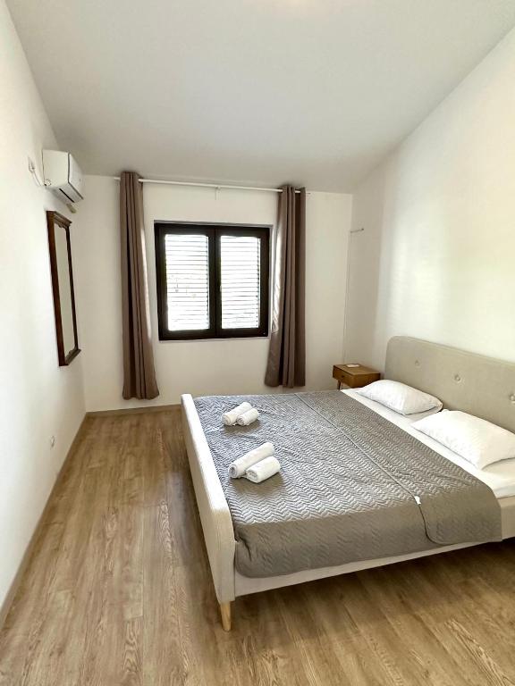 Postel nebo postele na pokoji v ubytování Guest house Kamelija