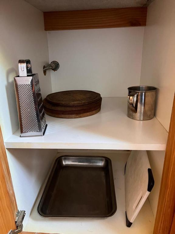 a kitchen counter with a sink and a cutting board at Duplex Ñancu Lahuen 1 Y 2 in Villa Traful