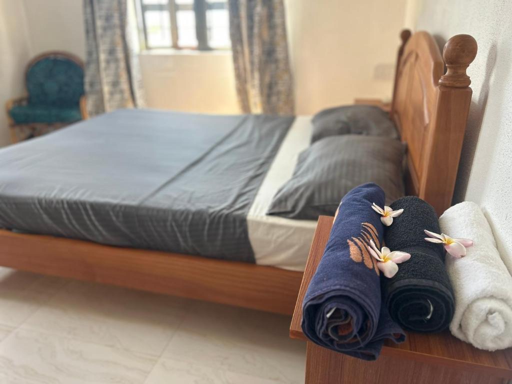 Postel nebo postele na pokoji v ubytování Skipper Dan Bungalow