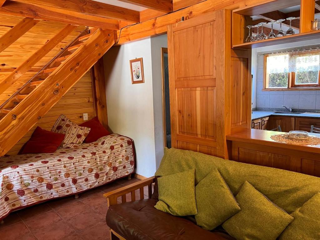 a living room with a couch in a house at Duplex Ñancu Lahuen 1 Y 2 in Villa Traful
