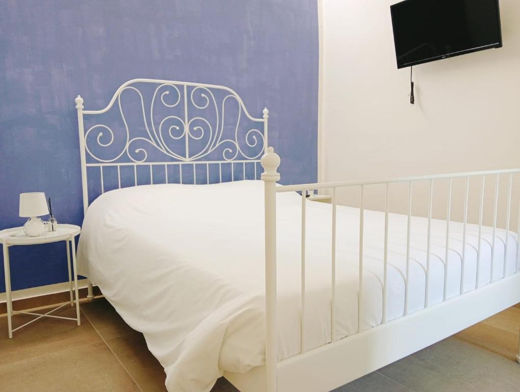 Postel nebo postele na pokoji v ubytování Modena Rooms