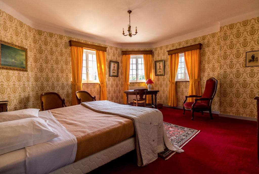 Postel nebo postele na pokoji v ubytování Manoir Du Stang