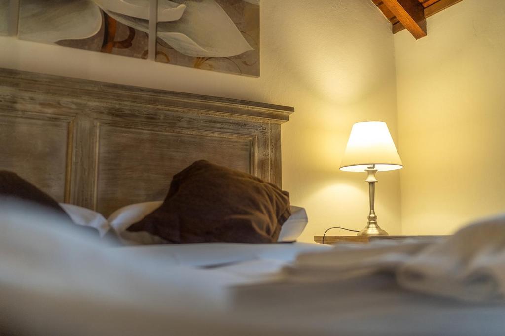 Postel nebo postele na pokoji v ubytování Apart & Hotel La Fontaine - by ROTUI