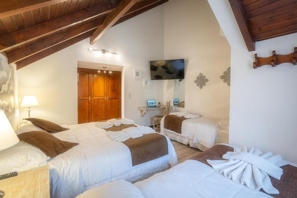 Postel nebo postele na pokoji v ubytování Apart & Hotel La Fontaine - by ROTUI