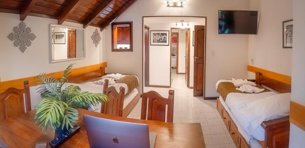 Postel nebo postele na pokoji v ubytování Apart & Hotel La Fontaine - by ROTUI