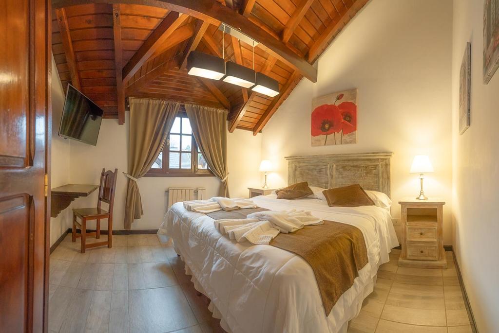 Postel nebo postele na pokoji v ubytování Apart & Hotel La Fontaine - by ROTUI