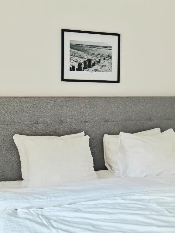 Postel nebo postele na pokoji v ubytování Gårdshotellet
