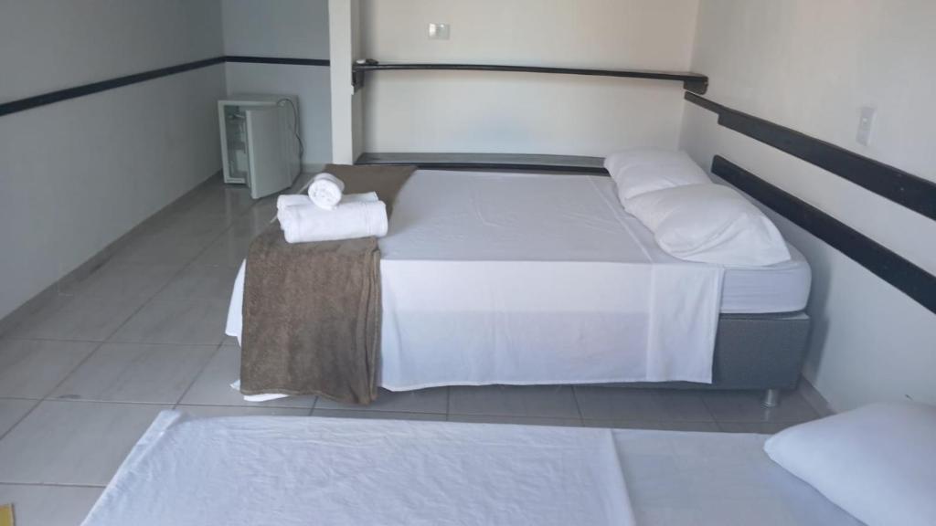 Postel nebo postele na pokoji v ubytování Hospedagem Clima Mar