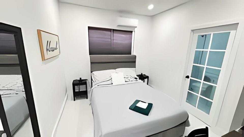 Ένα ή περισσότερα κρεβάτια σε δωμάτιο στο Private Rooms close to Miami Airport - Free parking - 01