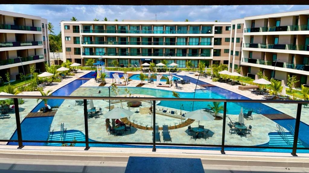 an image of a swimming pool in a hotel at Malia Beach in Ipojuca