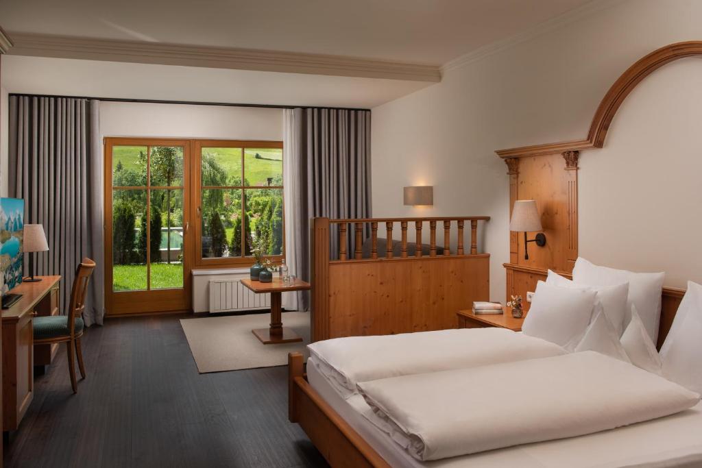 Postel nebo postele na pokoji v ubytování Naturhotel MOLIN