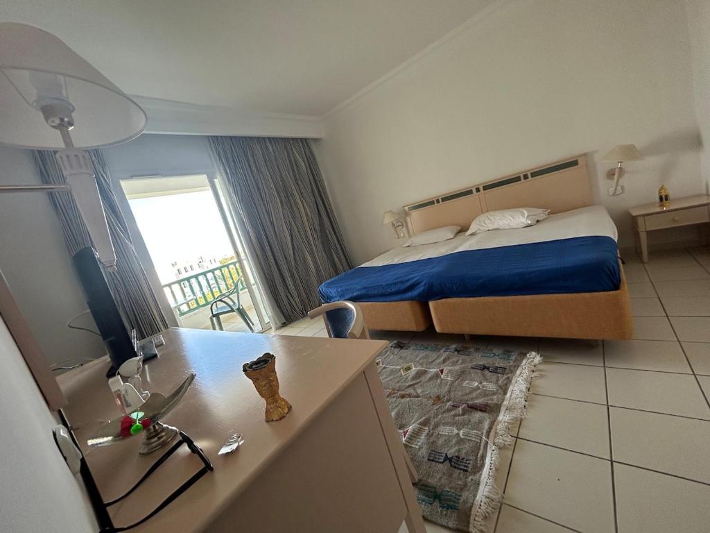 Postel nebo postele na pokoji v ubytování Yasmina Hotel Appartment