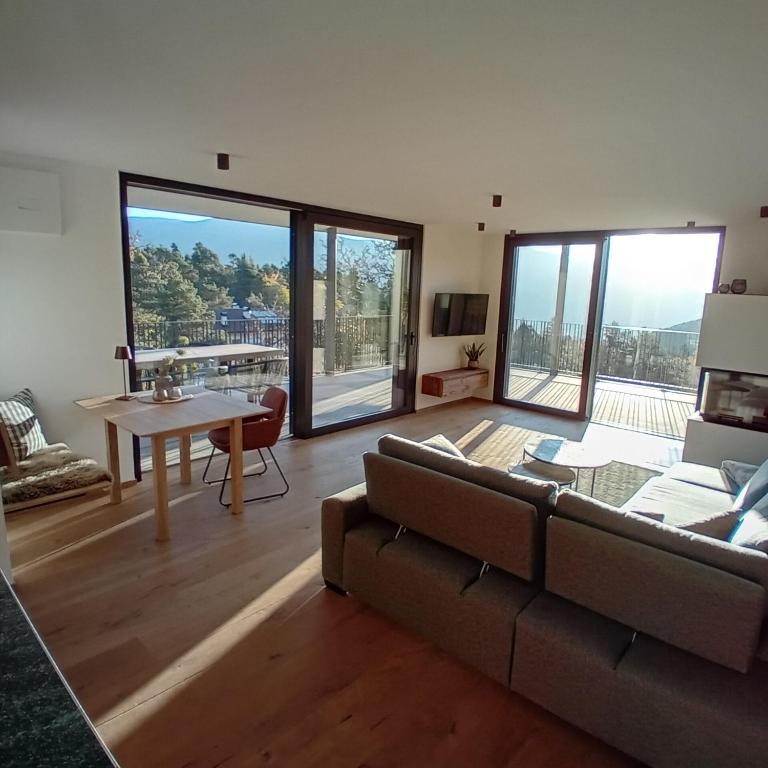 a living room with a couch and a table at FeWo Passo-Palade in Tesimo