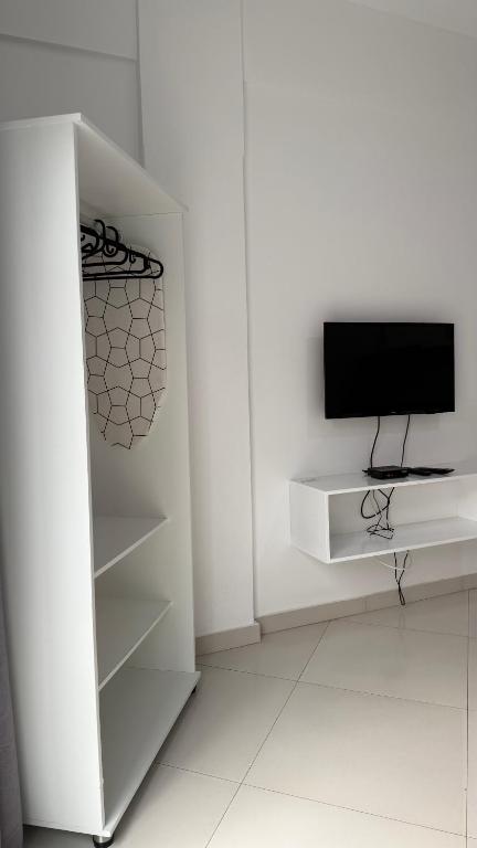 TV a/nebo společenská místnost v ubytování Urban Praia Maria - ApartHotel