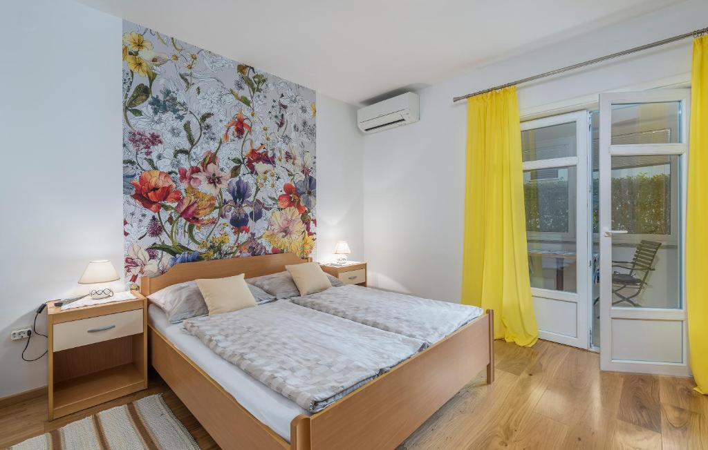 a bedroom with a bed and a painting on the wall at Guesthouse Casa Nova in Poreč
