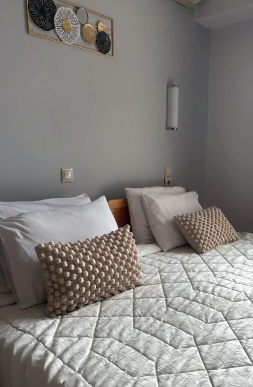 Postel nebo postele na pokoji v ubytování Hotel Rodini