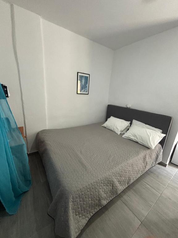Postel nebo postele na pokoji v ubytování Scirocco Rooms