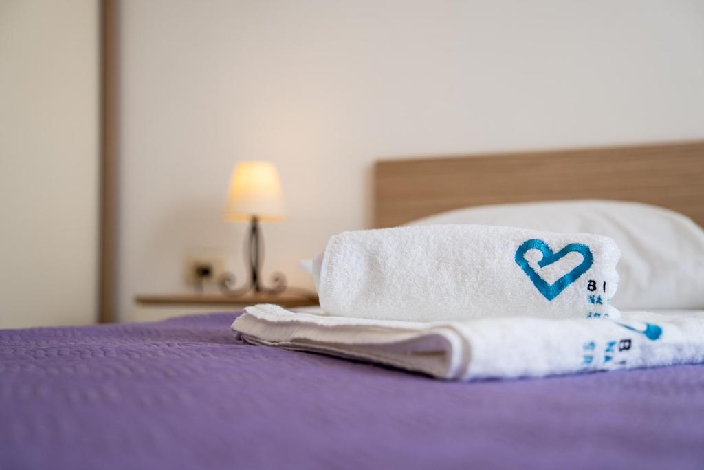 Postel nebo postele na pokoji v ubytování Apartments A&A