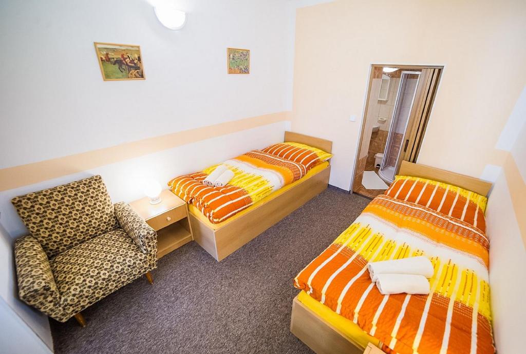 Postel nebo postele na pokoji v ubytování Pension Jana