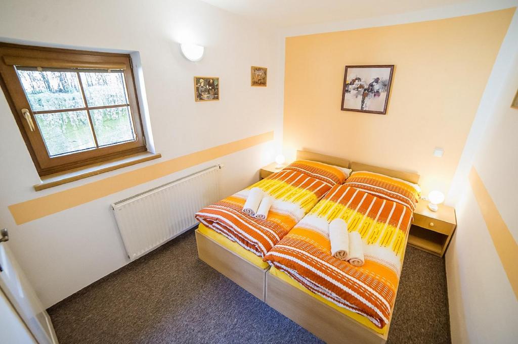 Postel nebo postele na pokoji v ubytování Pension Jana