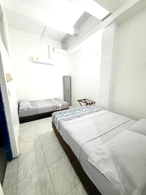 Postel nebo postele na pokoji v ubytování Hostal 1811